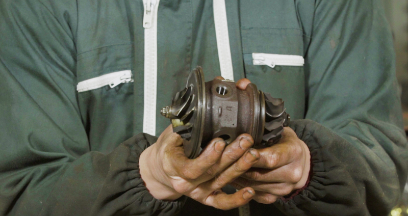 A glimpse at the turbine and compressor wheels still mounted to their shafts, which rides on the bearings in the center housing. Photo: Jared Auslander
